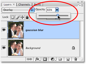 Lowering the opacity of the layer to 65% in Photoshop. 